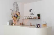 The Energy Studio Vienna tea and energy bar with its hand and eye mural, matcha and golden latte menu